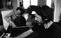 Composer Adrian Walther seated by his piano, crafting royalty free music for ads, podcasts, and social content for video freelancers to use.
