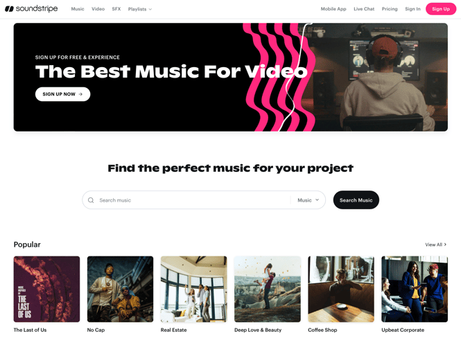 A content creator works on a computer, using one of the best websites for music, Soundstripe